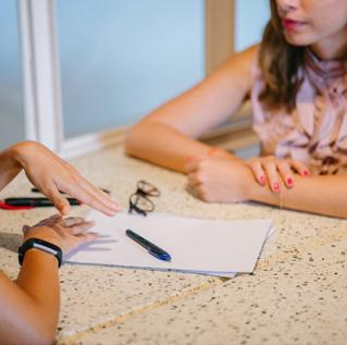 two people discussing paperwork